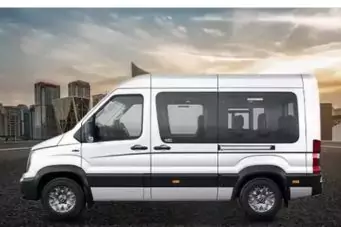 17-seater white Force Urbania for rent in Delhi, a spacious luxury option for group travel