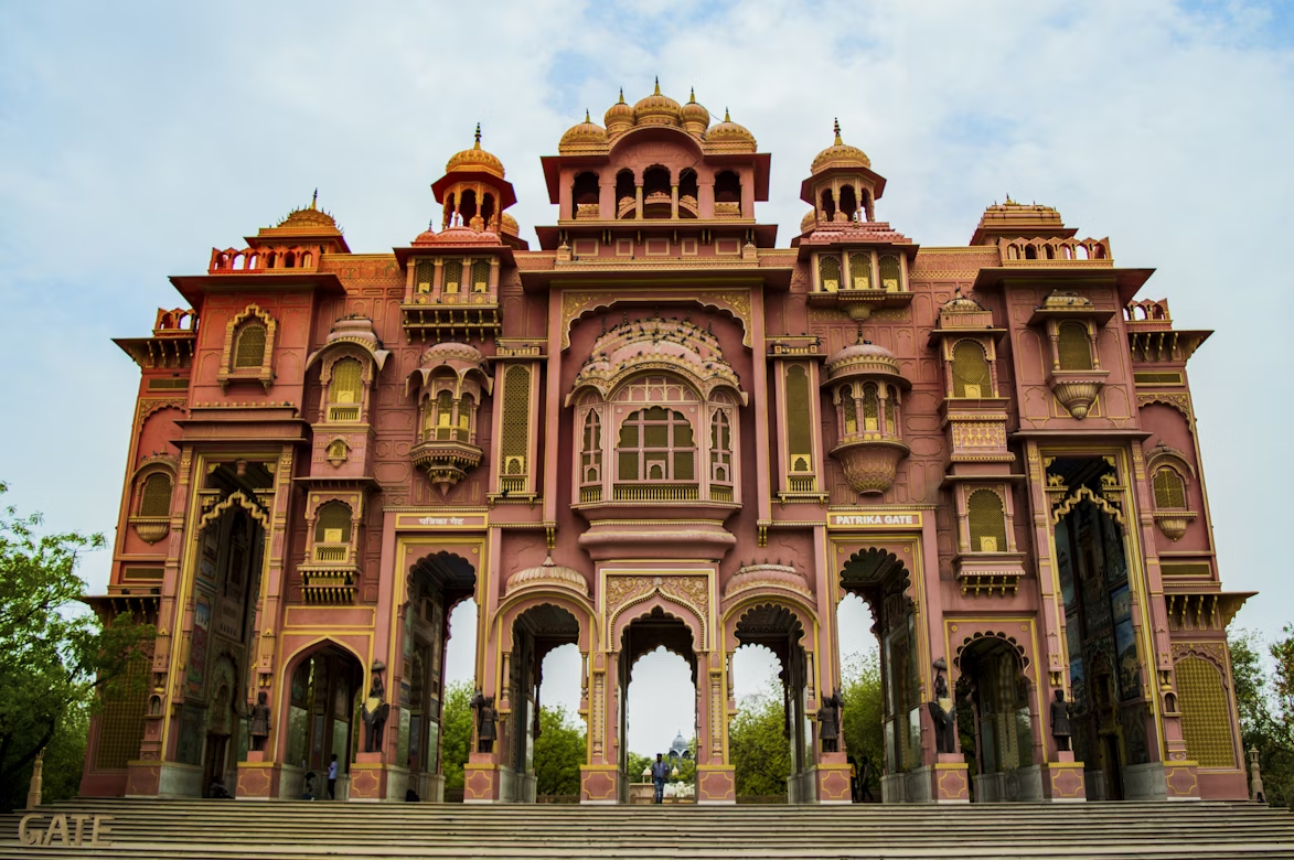 Family road trip from Delhi to Jaipur, featuring Patrika Gate's pink-yellow architecture, ideal for a weekend getaway